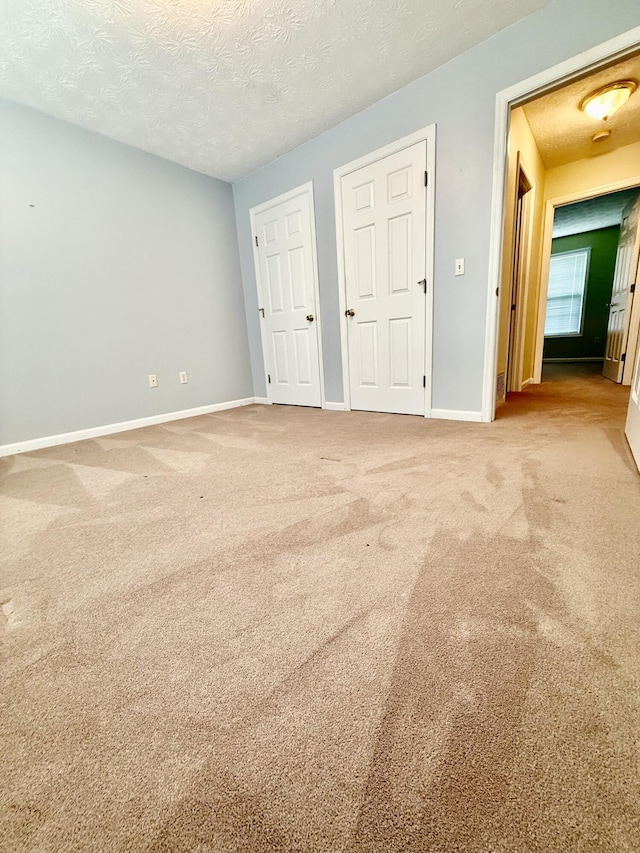 1012 Heathcliff Dr, Richmond, KY 40475 - unfurnished bedroom featuring carpet floors and a textured ceiling