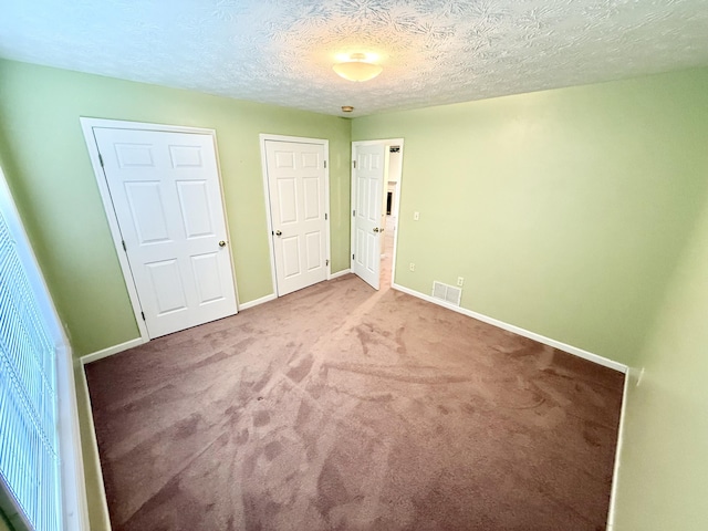 1012 Heathcliff Dr, Richmond, KY 40475 - unfurnished bedroom featuring carpet and a textured ceiling