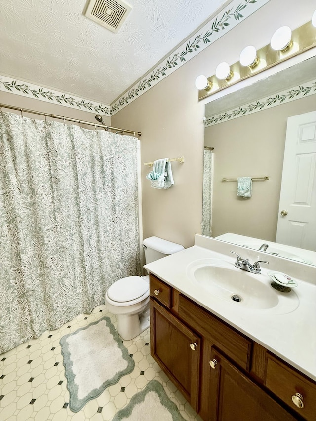 1012 Heathcliff Dr, Richmond, KY 40475 - bathroom with vanity, a textured ceiling, tile patterned floors, and a shower with shower curtain