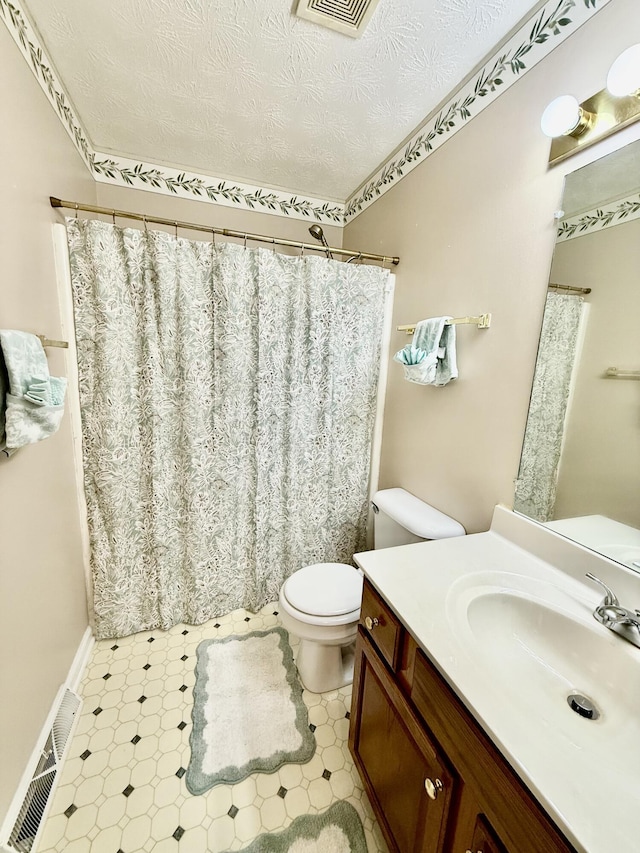 1012 Heathcliff Dr, Richmond, KY 40475 - full bathroom with vanity, a textured ceiling, a shower with curtain, and tile patterned floors