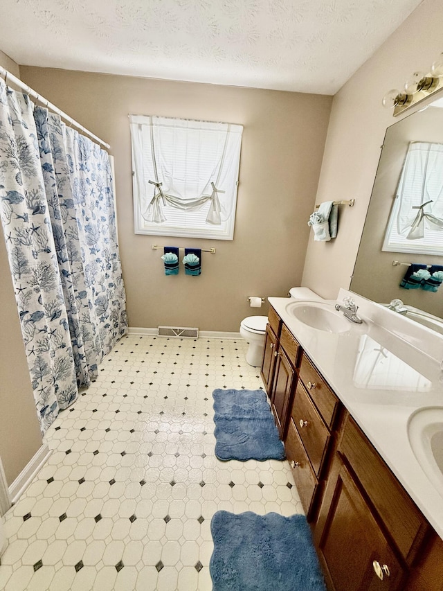 1012 Heathcliff Dr, Richmond, KY 40475 - full bathroom featuring double vanity, a textured ceiling, tile patterned floors, and a shower with shower curtain
