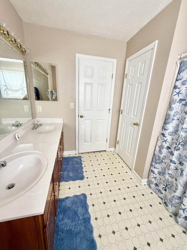 1012 Heathcliff Dr, Richmond, KY 40475 - bathroom with double vanity and baseboards