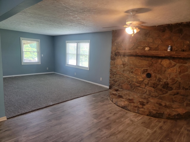 3380 Upton Talley Rd, Upton, KY 42784 - unfurnished living room featuring ceiling fan, a textured ceiling, plenty of natural light, and wood finished floors