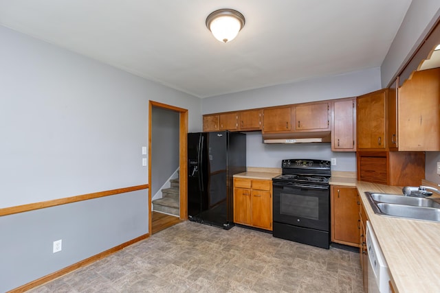 120 Vanderbilt Dr, Lexington, KY 40517 - kitchen featuring black appliances, under cabinet range hood, light countertops, and brown cabinets