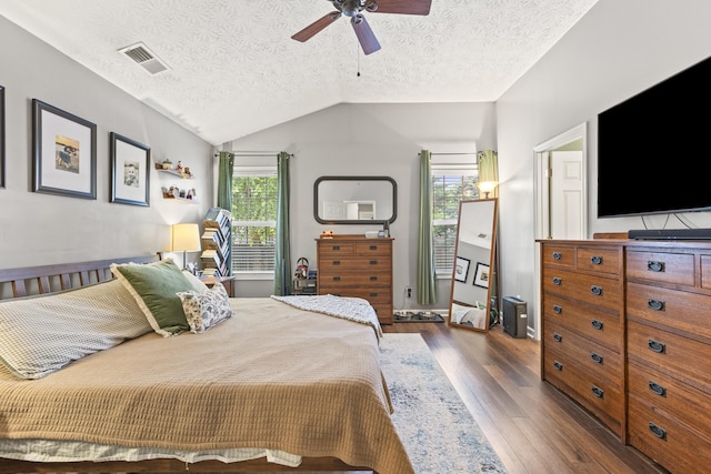 821 White Wood Flt, Lexington, KY 40511 - bedroom featuring dark wood finished floors, a textured ceiling, vaulted ceiling, and a ceiling fan