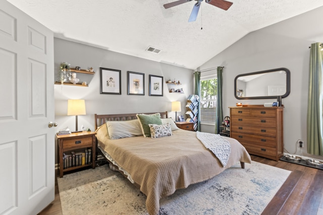 821 White Wood Flt, Lexington, KY 40511 - bedroom featuring a textured ceiling, wood finished floors, vaulted ceiling, and ceiling fan
