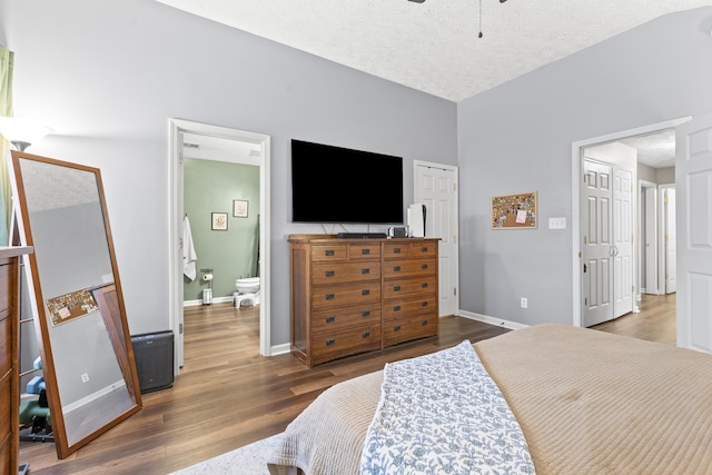 821 White Wood Flt, Lexington, KY 40511 - bedroom with wood finished floors, ensuite bath, and a textured ceiling