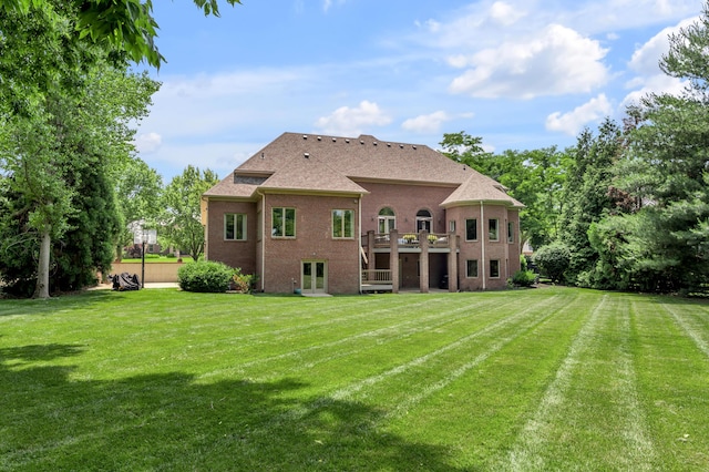 103 Windridge Dr, Nicholasville, KY 40356 - back of property featuring a lawn, brick siding, a shingled roof, a wooden deck, and french doors
