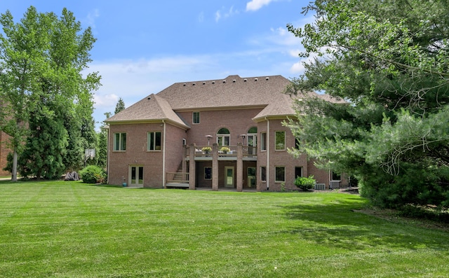 103 Windridge Dr, Nicholasville, KY 40356 - rear view of house with stairway, a wooden deck, a lawn, and brick siding