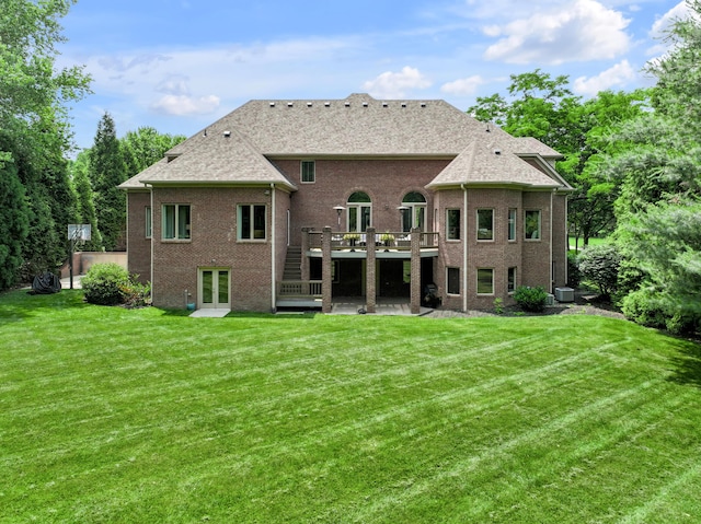 103 Windridge Dr, Nicholasville, KY 40356 - rear view of property featuring a wooden deck, french doors, brick siding, and a yard