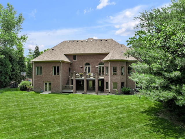 103 Windridge Dr, Nicholasville, KY 40356 - rear view of house featuring a patio area, a wooden deck, a lawn, brick siding, and french doors