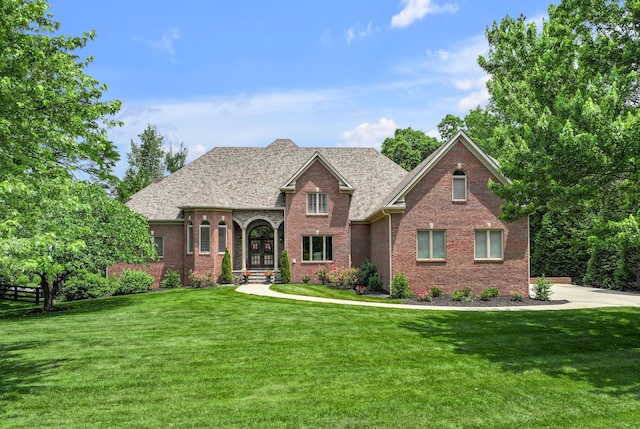 103 Windridge Dr, Nicholasville, KY 40356 - view of front facade with brick siding, a front yard, and a shingled roof