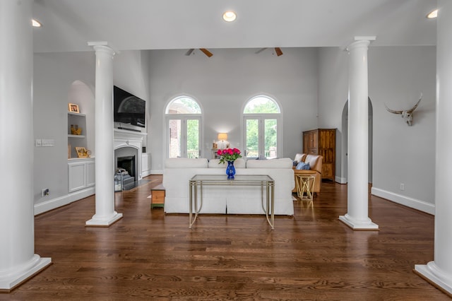 103 Windridge Dr, Nicholasville, KY 40356 - living room with recessed lighting, a fireplace, dark wood finished floors, built in features, and ornate columns