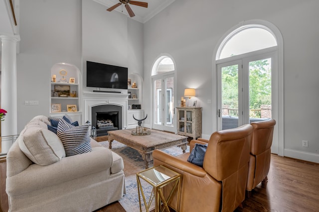 103 Windridge Dr, Nicholasville, KY 40356 - living room featuring ceiling fan, ornamental molding, a high ceiling, built in shelves, and wood finished floors