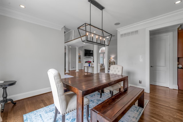 103 Windridge Dr, Nicholasville, KY 40356 - dining space featuring arched walkways, wood finished floors, crown molding, and recessed lighting