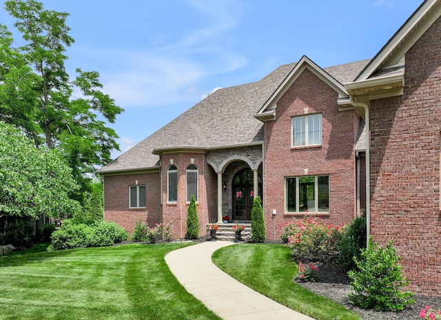 103 Windridge Dr, Nicholasville, KY 40356 - view of front of home with a front lawn, brick siding, and roof with shingles