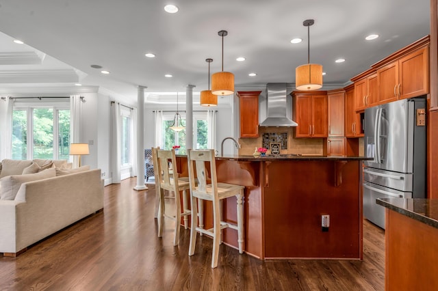 103 Windridge Dr, Nicholasville, KY 40356 - kitchen featuring wall chimney range hood, stainless steel fridge, crown molding, healthy amount of natural light, and recessed lighting