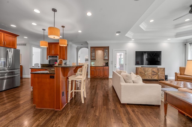 103 Windridge Dr, Nicholasville, KY 40356 - living room featuring arched walkways, crown molding, recessed lighting, dark wood-style flooring, and healthy amount of natural light