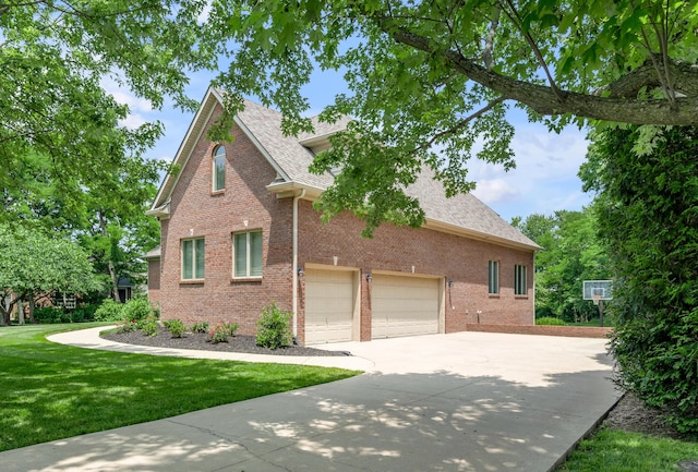103 Windridge Dr, Nicholasville, KY 40356 - traditional-style home featuring concrete driveway, brick siding, a front yard, and a shingled roof