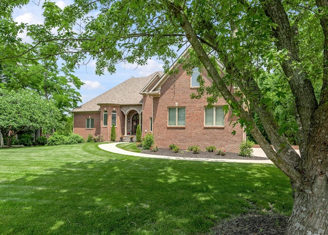 103 Windridge Dr, Nicholasville, KY 40356 - view of front of home featuring brick siding, a front yard, and roof with shingles