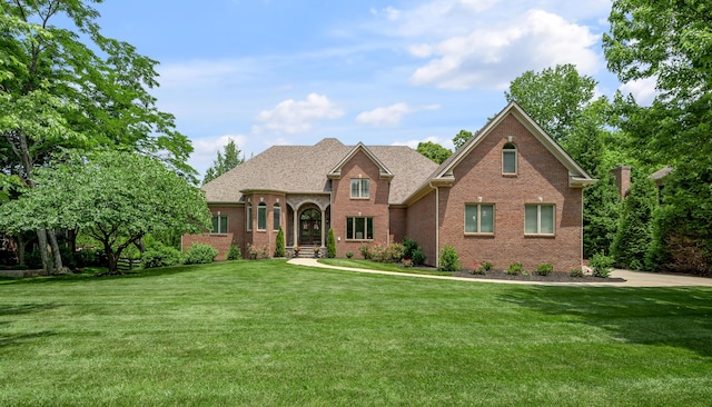 103 Windridge Dr, Nicholasville, KY 40356 - view of front of property with brick siding, a front yard, and a shingled roof