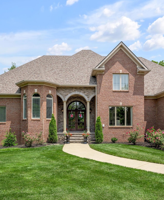 103 Windridge Dr, Nicholasville, KY 40356 - view of front of property with french doors, a front lawn, brick siding, and a shingled roof
