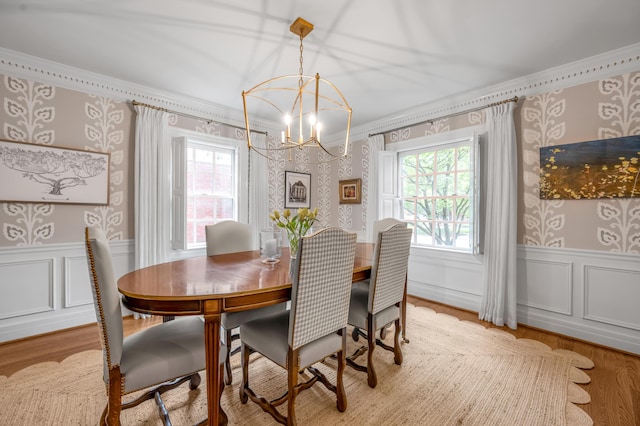 341 Kingsway Dr, Lexington, KY 40502 - dining area featuring wallpapered walls, ornamental molding, a chandelier, a wainscoted wall, and healthy amount of natural light