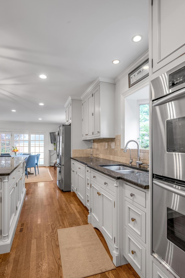 341 Kingsway Dr, Lexington, KY 40502 - kitchen featuring appliances with stainless steel finishes, white cabinetry, decorative backsplash, and recessed lighting