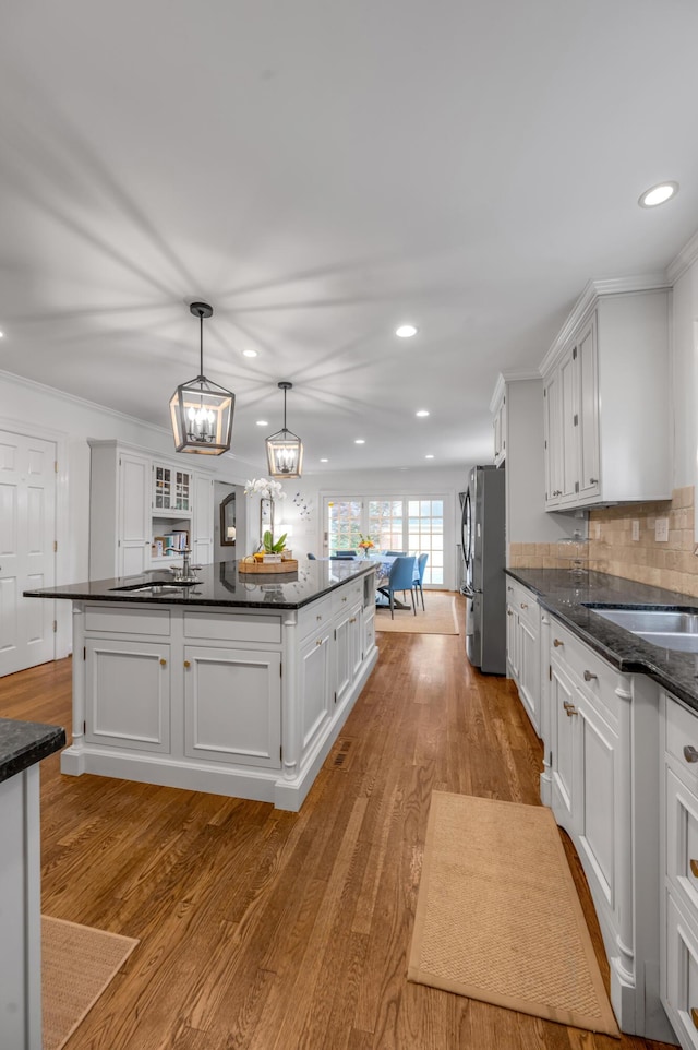 341 Kingsway Dr, Lexington, KY 40502 - kitchen with freestanding refrigerator, white cabinets, recessed lighting, wood finished floors, and ornamental molding