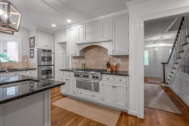 341 Kingsway Dr, Lexington, KY 40502 - kitchen with a warming drawer, appliances with stainless steel finishes, light wood finished floors, healthy amount of natural light, and recessed lighting