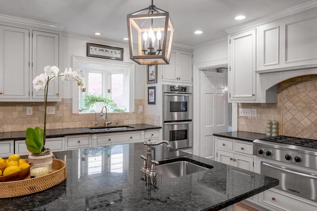 341 Kingsway Dr, Lexington, KY 40502 - kitchen featuring stainless steel appliances, a warming drawer, white cabinets, decorative backsplash, and crown molding