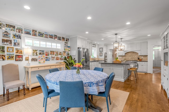 341 Kingsway Dr, Lexington, KY 40502 - dining room with recessed lighting, light wood-style flooring, and crown molding