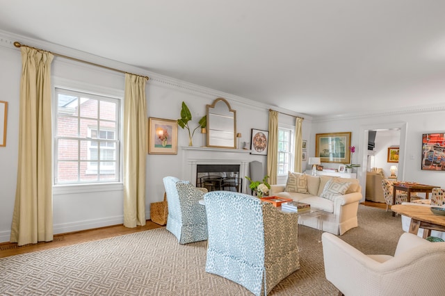 341 Kingsway Dr, Lexington, KY 40502 - living area featuring wood finished floors, a glass covered fireplace, and crown molding
