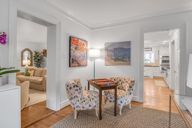 341 Kingsway Dr, Lexington, KY 40502 - sitting room featuring light wood-style flooring and ornamental molding