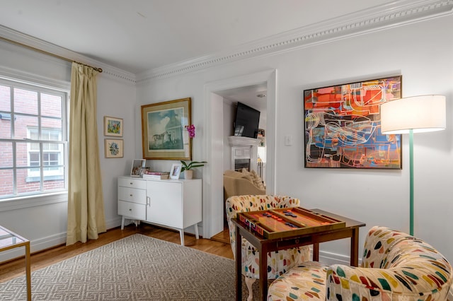 341 Kingsway Dr, Lexington, KY 40502 - sitting room with wood finished floors, crown molding, and a fireplace