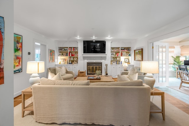 341 Kingsway Dr, Lexington, KY 40502 - living area with ornamental molding, a glass covered fireplace, and built in features