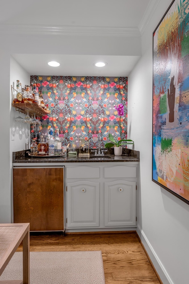 341 Kingsway Dr, Lexington, KY 40502 - indoor wet bar with crown molding, light wood-type flooring, and recessed lighting