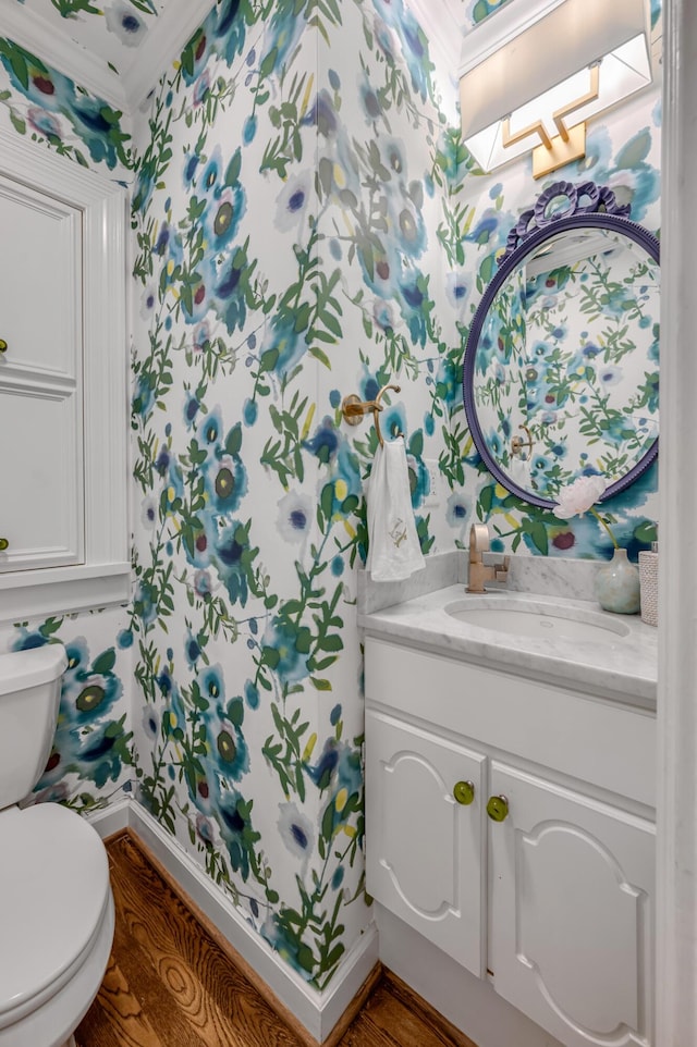 341 Kingsway Dr, Lexington, KY 40502 - half bath featuring wallpapered walls, vanity, ornamental molding, and wood finished floors