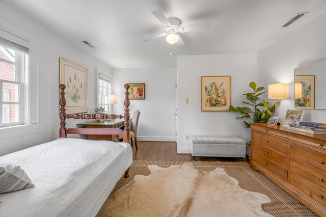 341 Kingsway Dr, Lexington, KY 40502 - bedroom featuring multiple windows, wood finished floors, and a ceiling fan