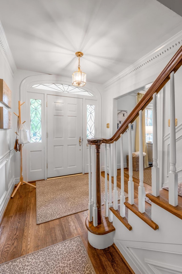 341 Kingsway Dr, Lexington, KY 40502 - entrance foyer with wood finished floors, stairs, and a chandelier