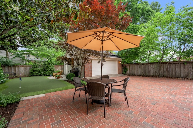 341 Kingsway Dr, Lexington, KY 40502 - fenced backyard featuring a putting green and a patio