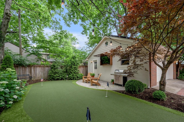 341 Kingsway Dr, Lexington, KY 40502 - view of yard featuring a putting green and concrete driveway