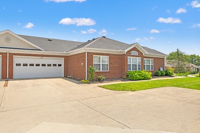 139 Delissa Dr, Georgetown, KY 40324 - view of front of property featuring brick siding, driveway, an attached garage, and roof with shingles