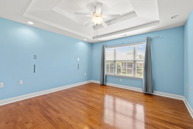 139 Delissa Dr, Georgetown, KY 40324 - spare room with a tray ceiling, wood finished floors, a ceiling fan, and recessed lighting