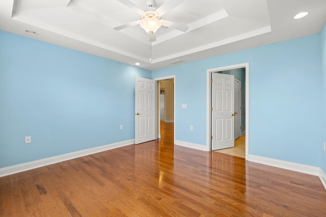 139 Delissa Dr, Georgetown, KY 40324 - unfurnished room with a raised ceiling, wood finished floors, a ceiling fan, and recessed lighting