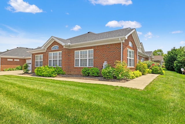 139 Delissa Dr, Georgetown, KY 40324 - view of property exterior with brick siding, a lawn, a garage, concrete driveway, and roof with shingles
