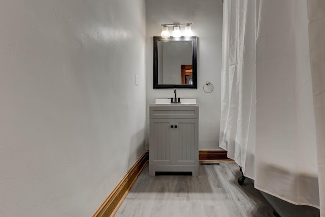 236 W High St, Mt Sterling, KY 40353 - bathroom featuring wood finished floors and vanity