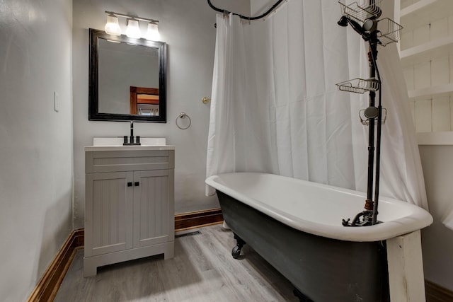 236 W High St, Mt Sterling, KY 40353 - full bath featuring wood finished floors, a freestanding bath, and vanity