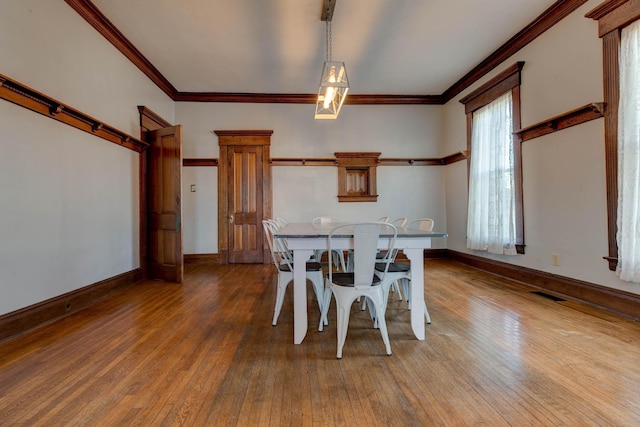 236 W High St, Mt Sterling, KY 40353 - dining room with hardwood / wood-style floors and ornamental molding