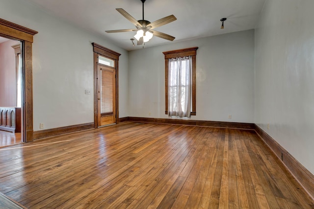 236 W High St, Mt Sterling, KY 40353 - unfurnished room with healthy amount of natural light, hardwood / wood-style floors, and a ceiling fan